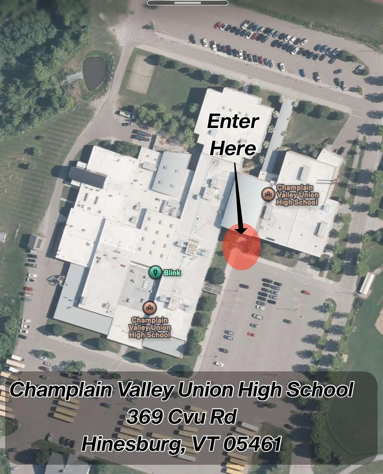 A satellite map of the Champlain Valley Union High School with an arrow pointing at the entrance to the building.